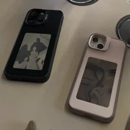 Two Morph cases side by side on a restaurant table, a photo on each panel