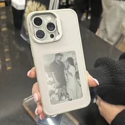 Savannah's Light case in her hand, a couple's photo on its panel