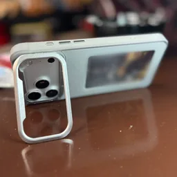 Sneha's Light Canvas Pro standing on its kickstand on a table, the picture on its panel blurred